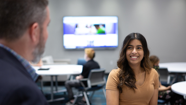 Student speaking with advisor