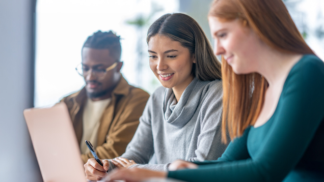 Three students studying in class