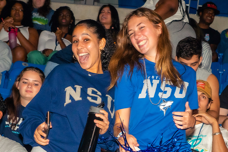 NSU students smiling during an event.