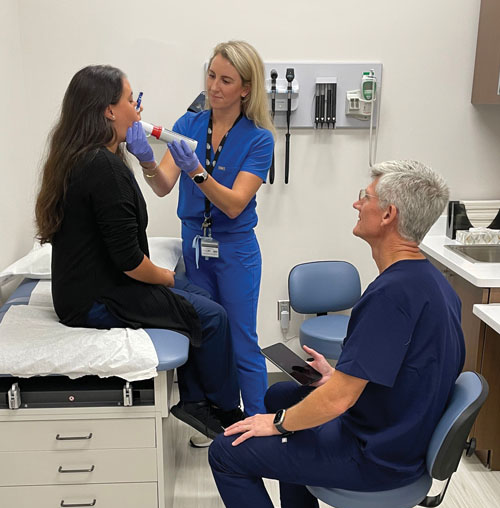 NSU health physician examining patient